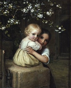 Girl holding a child under a blossoming apple tree