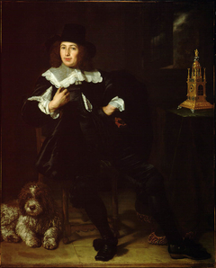 Portrait of a man, possibly Joan Hulft (1610-1677), with a dog, seated at a table with a clock by Bartholomeus van der Helst
