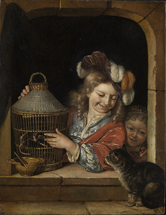 Two children with a cat and birdcage in a window