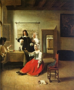 Woman drinking with two men and a maid in an interior