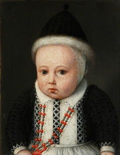 A Small Child in a Fur-lined Cap and with a Necklace with Coral Beads