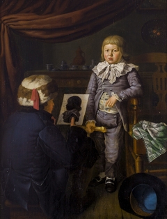 An Artist Painting a Silhouette Portrait of a Young Boy