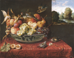 Still life with fruit bowl on a table and view of a landscape through an open window