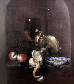 Still life with roemer, tazza, lemon and peaches in a niche