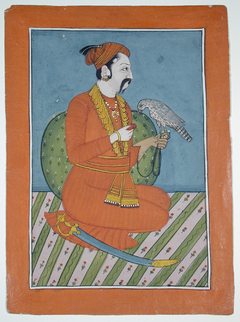 A kneeling raja with his falcon