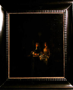 Paar bij kaarslicht aan tafel. by Gerhard Jan Palthe