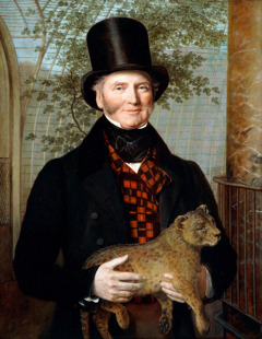 Portrait of Edward Cross, half-length, in a black coat and red-check waistcoat holding a Lion Cub by Jacques-Laurent Agasse