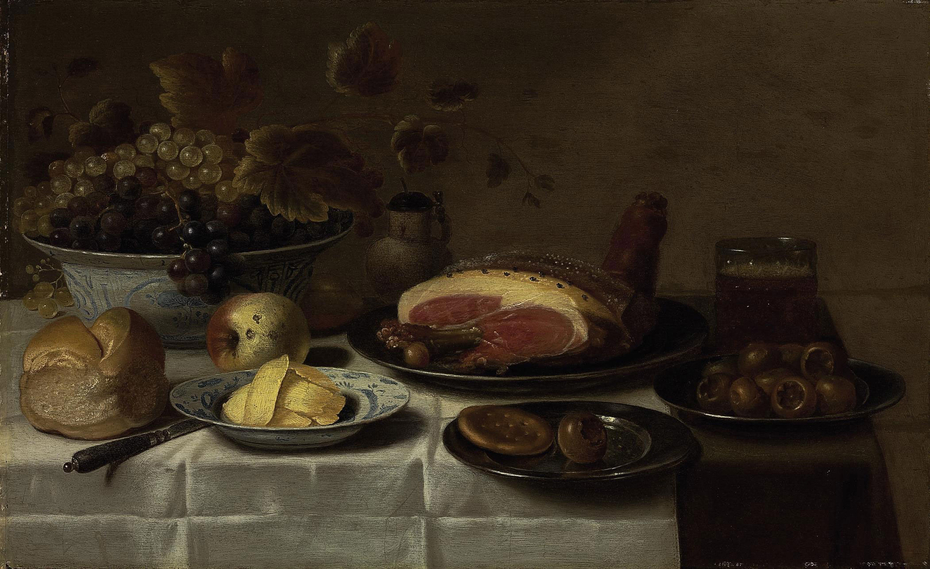 Still life of fruit and ham on a laid table