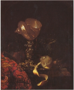 Still life with shell cup, glasses and a lemon by Willem Kalf