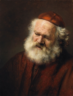Bust of an old bearded man with red cap by Rembrandt