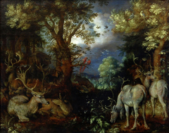 Herten in een bosrijk landschap