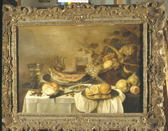 Still life with salmon and fruit basket by Pieter Claesz