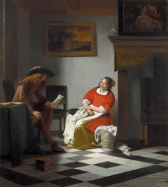 Man reading letter to a woman
