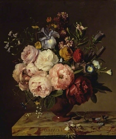 A vase of flowers on a ledge by Jan Frans van Dael