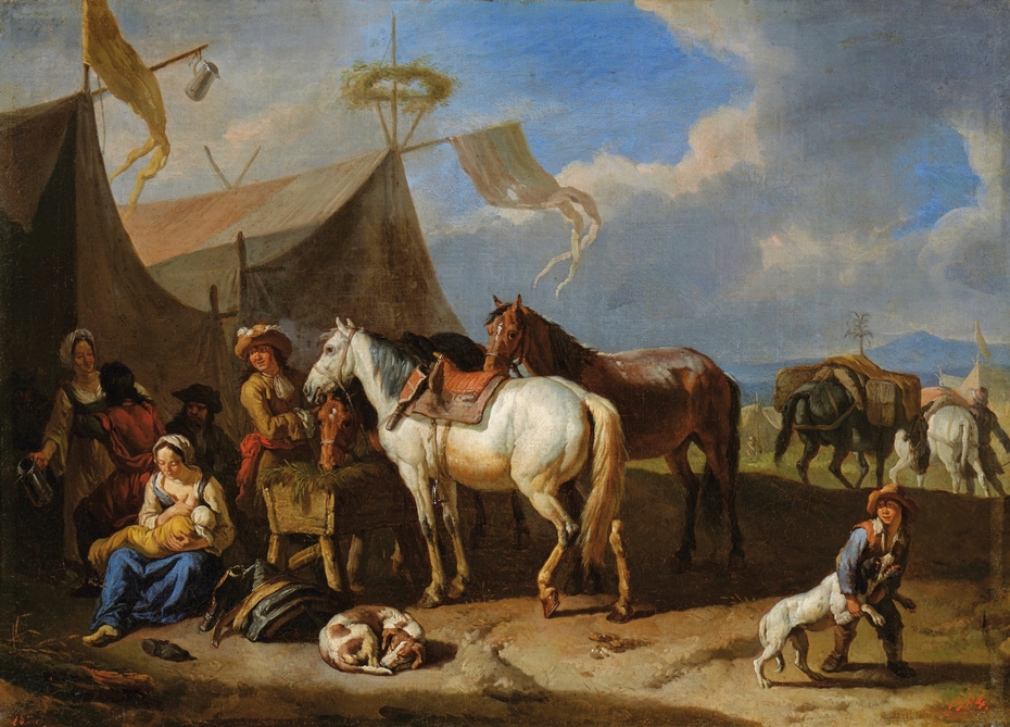 Camp scene with a woman nursing a baby