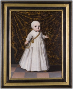 Portrait of a child, holding a flower in her hand