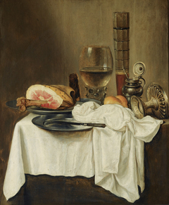 Still life with ham, a wineglass and a tazza on a draped table