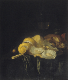 Still life with oysters and peeled lemon.
