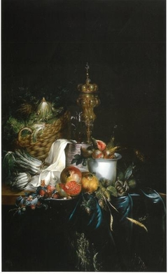 Sumptuous table with fruit and covered beaker