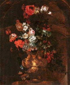 Vase with flowers in a niche