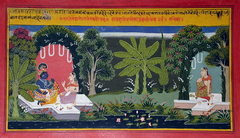 A gopi waits in a bower. Krishna talks with another gopi in another bower