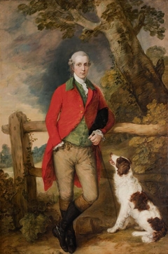 Portrait of Robert Thistlethwayte of Norman Court, standing full-length, wearing a red coat, green waistcoat and buff breaches, holding a can, leaning against a fence, a spaniel by his side