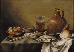 Still life with smoking equipment, herrings, a beer glass and a stone jug by Pieter Claesz