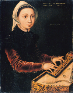 Young woman playing a virginal