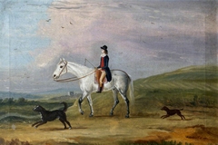 A Young Rider on a Grey Horse, and Two Dogs