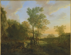 An Italianate wooded landscape with travellers