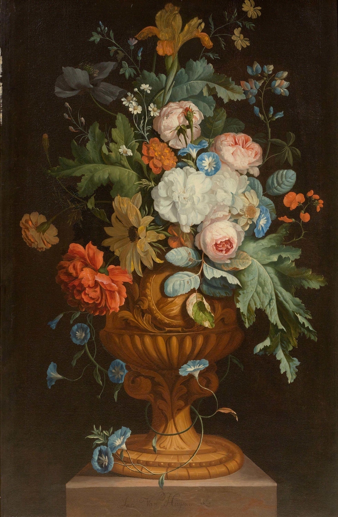 Flowers in a terracotta vase on a pedestal