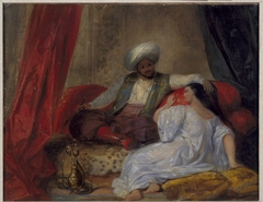 An Arab Smoking a Hookah with a Woman at His Feet