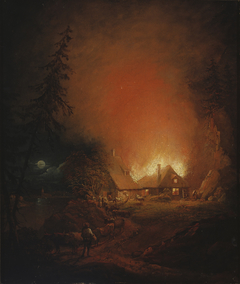 Fire at night in a farmhouse