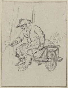 Man met hoed zittend op een kruiwagen by Unknown Artist