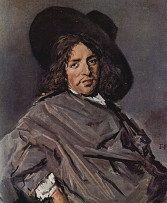 Portrait of a man in a gray cloak with wide brim hat