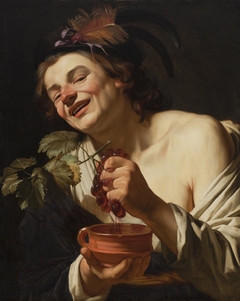 Smiling Young Man Squeezing Grapes