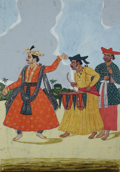 A male dancer accompanied by two musicians