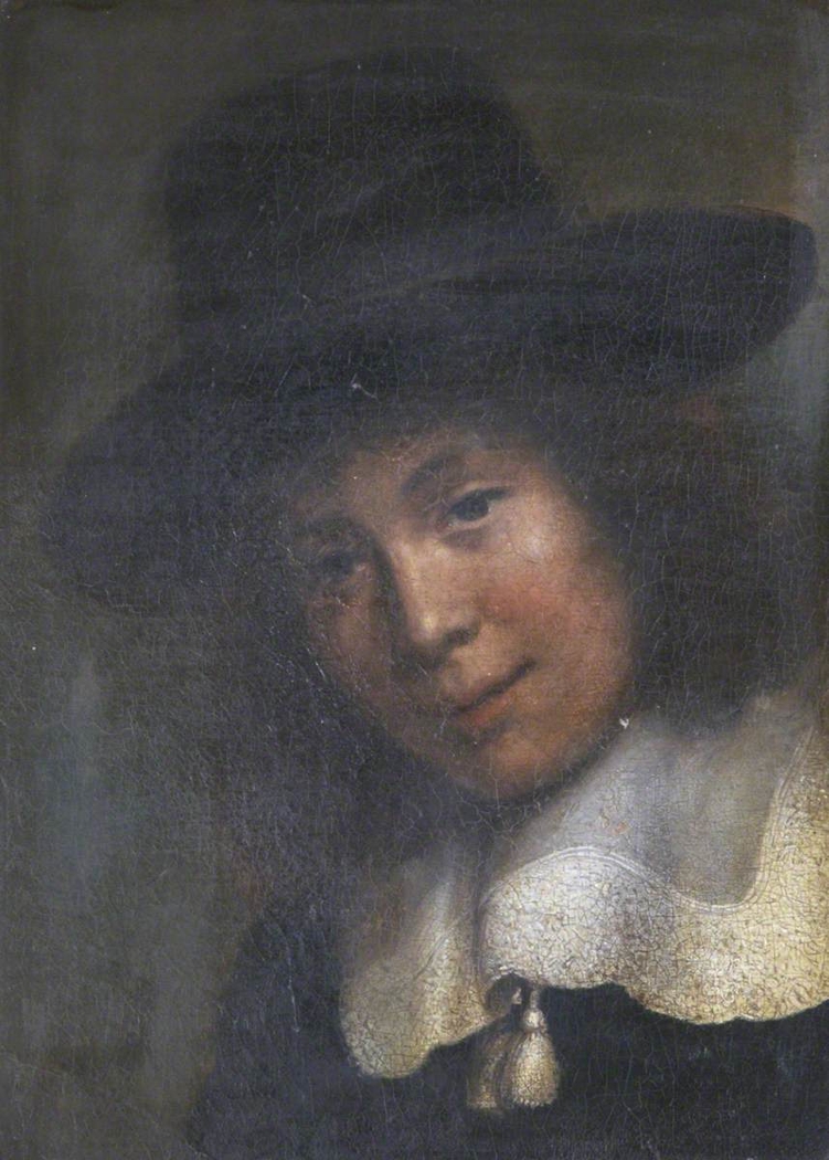 A Young Man in a Black Hat and White Lace Collar with Tassels