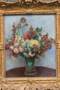 Flowers in a vase by Auguste Renoir