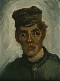 Head of a young peasant in a peaked cap
